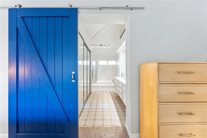 Custom barn door to primary bath