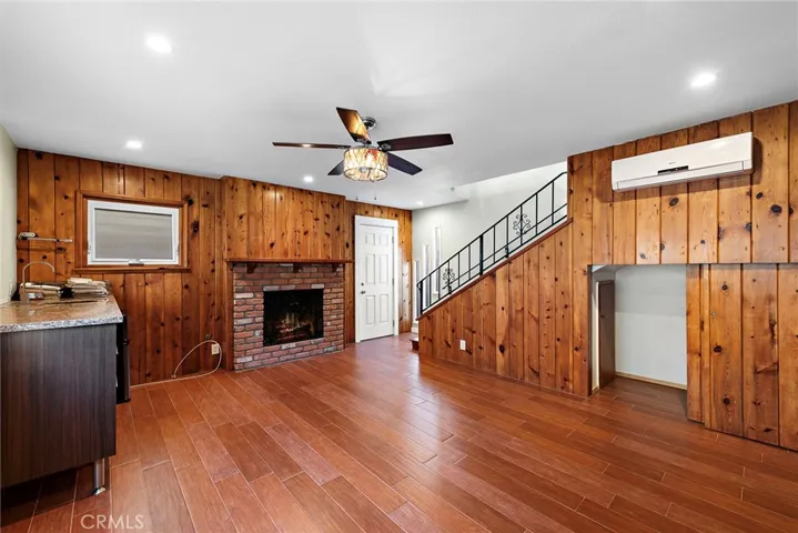 Rear downstairs living area with fireplace in potential ADU or 2nd unit