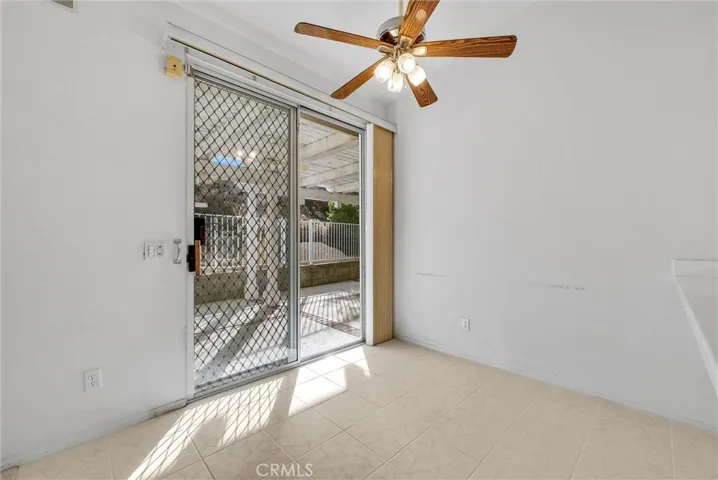 Kitchen dining area with sliding glass door leading to the patio.