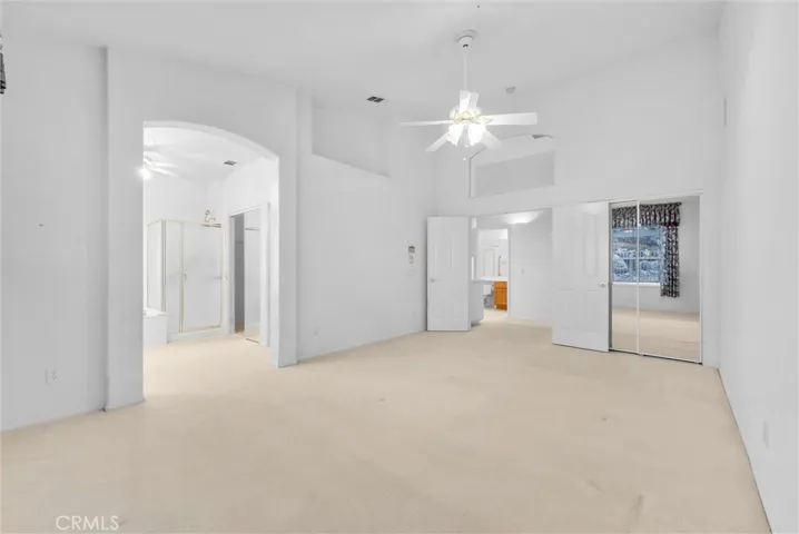 Master bedroom leading to master bath.  Two mirrored closets.