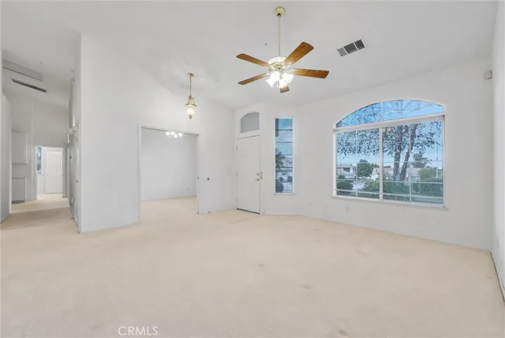 Entry to home with living room and den area.