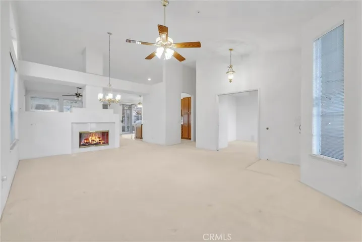 Large living room with den off to the side.
