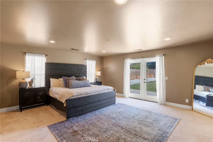 Primary bedroom with slider out to the backyard