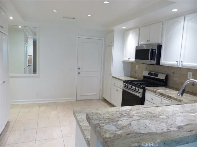 Open Kitchen with Nook, Direct Access to 2 Car Garage