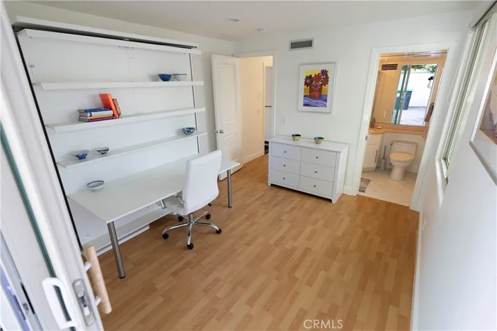 Bedroom/Office and 3/4 bath located on 2nd Level. Bookcase Murphy Bed.