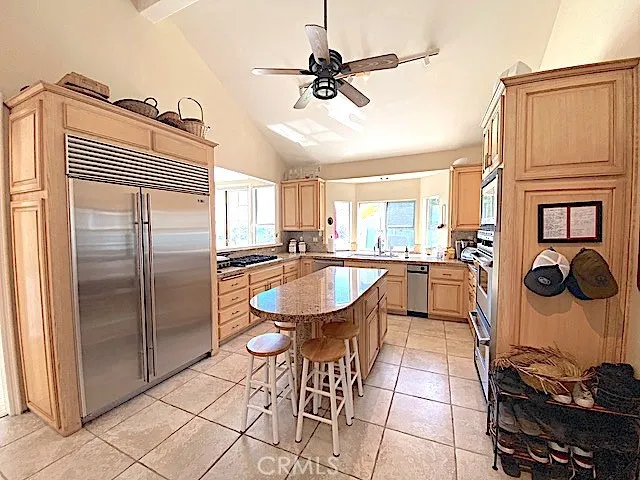 Light and bright kitchen with high end stainless stell appliances.