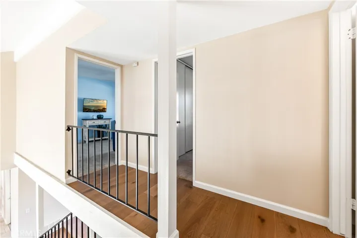 view from stairs looking at bedroom/office 5