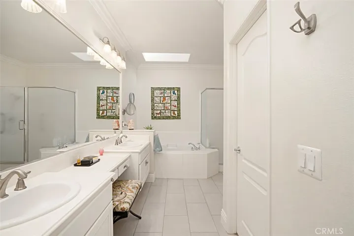 Vanity, walk in closet & oversized shower