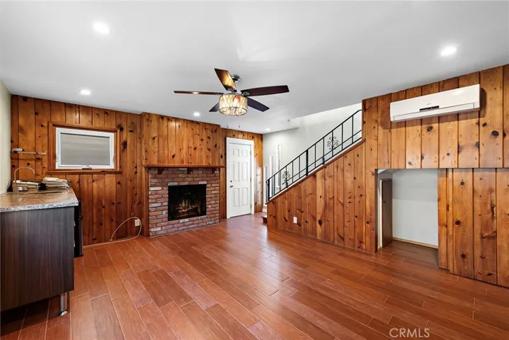 Rear downstairs living area with fireplace in potential ADU or 2nd unit
