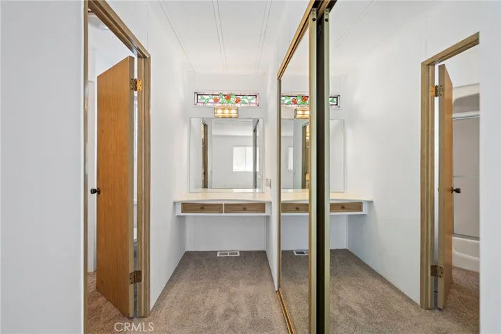 Large Master Bedroom Mirrored Closet. Photo shows 
 Private Master Bathroom Entrance