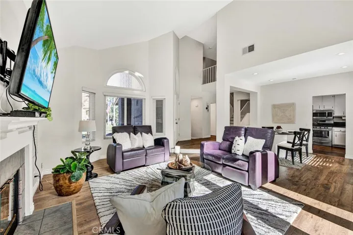Open Living Room Featuring a Fireplace