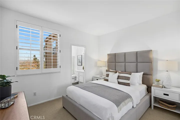 Bedroom w/ classic plantation shutters & gorgeous En-suite