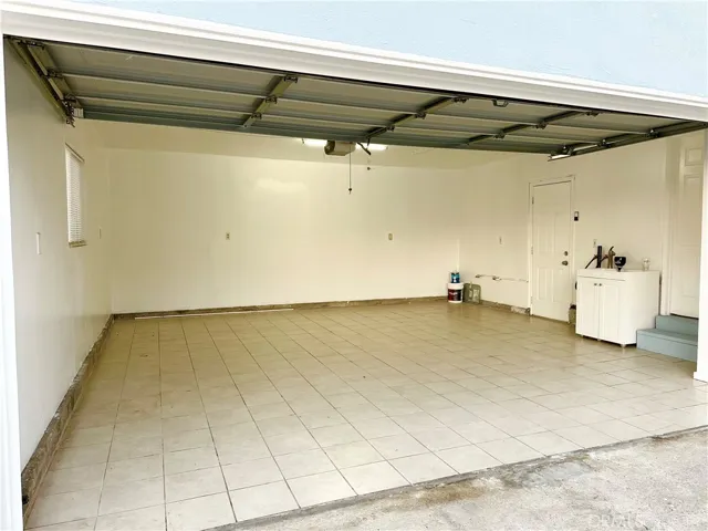 Upgraded two cars garage with tile floor and window.