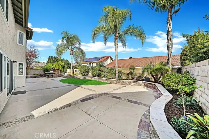 Expansive backyard experience provides time for entertaining and outdoor cooking over the custom BBQ.
