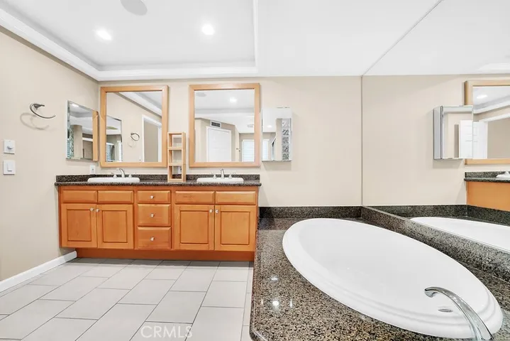 Primary bath suite soaking bathtub.