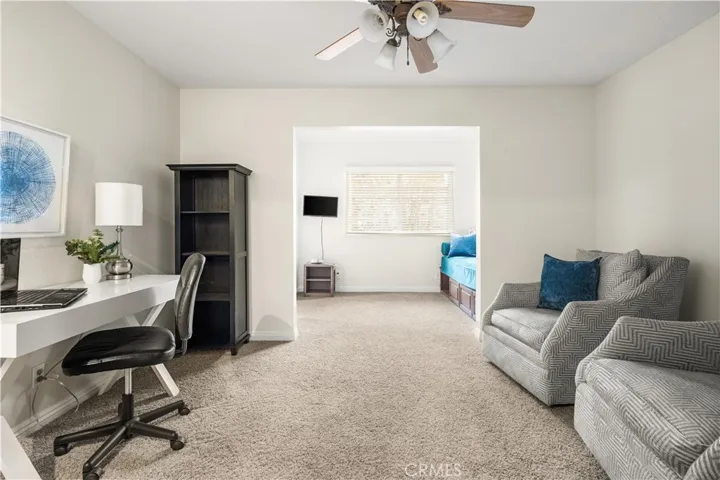 Large downstairs bedroom with walk in closet and sink