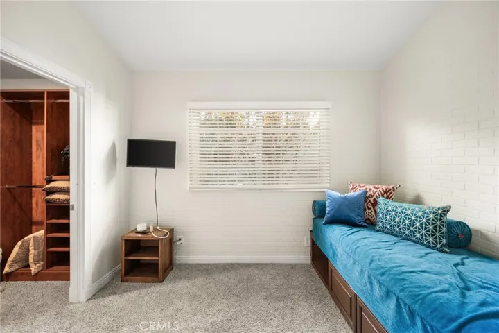 Walk-in closet in downstairs bedroom.