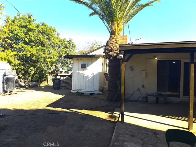 covered patio, shed stays.