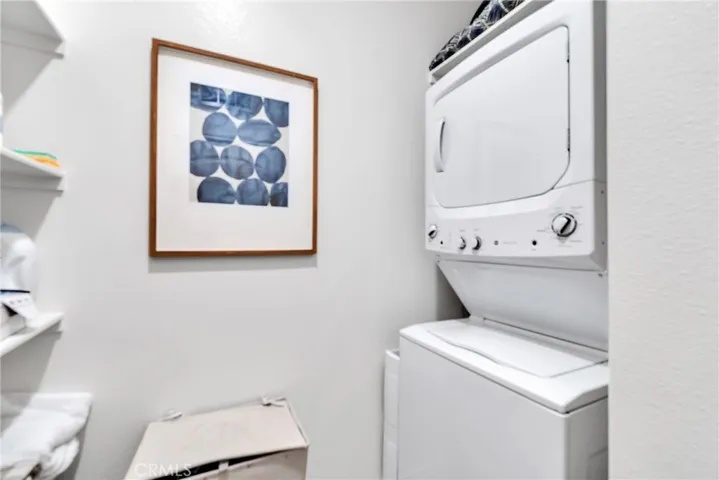 Downstairs unit own laundry room and storage