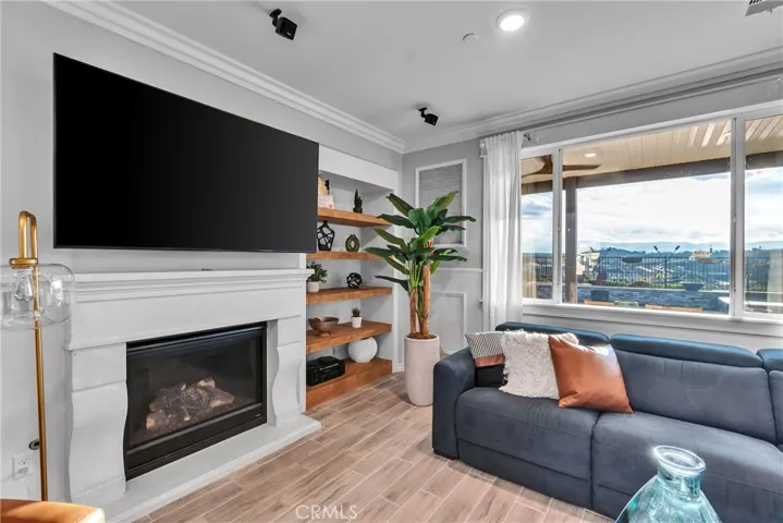 Fireplace in family room with views out to the pool and mountains