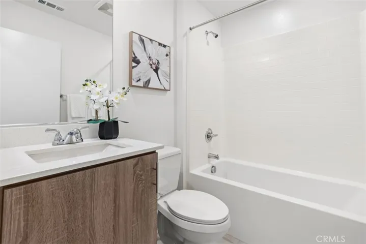 A spacious second full bathroom located next to Bedroom #2 for easy access.