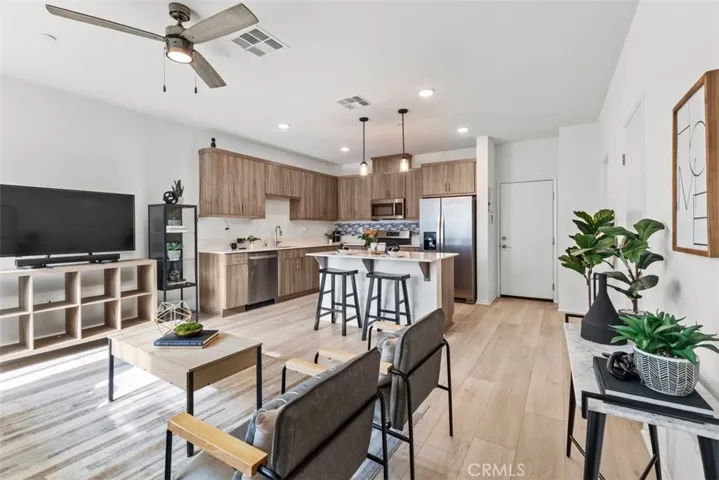 The open-concept layout is filled with natural light, making it ideal for both entertaining and everyday living.