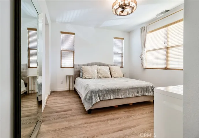 Primary bedroom is spacious, private with lots of windows