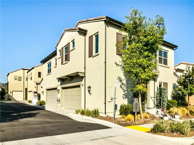 Corner location.  Home only paired at garage.  Corner homes rarely come on the market.  So much extra privacy!