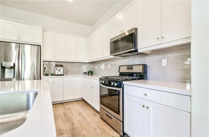 So much counter & cabinet space!  Bright & open