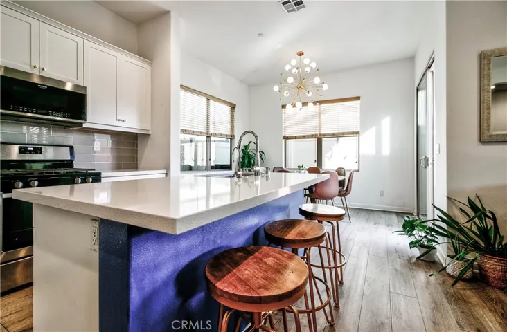 HUGE kitchen island overlooks both living & dining area
