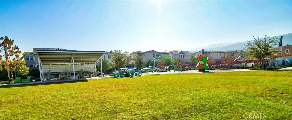 Bedford offers plenty of green grass & space.  Notice the lounging area & playground.  These are all over the Bedford community