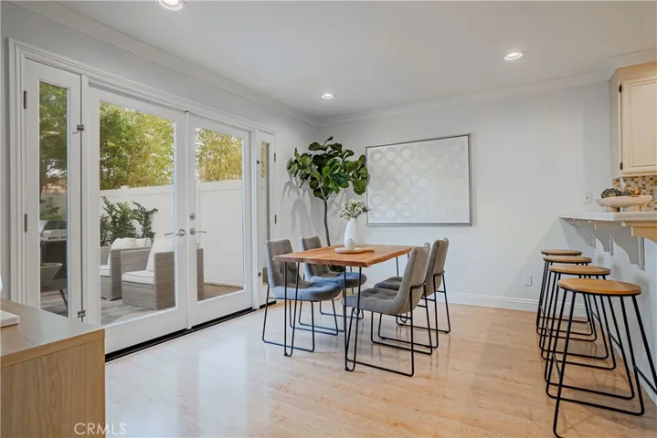 The family room area off the kitchen can be a versatile space for eating area with French doors that open to the backyard.