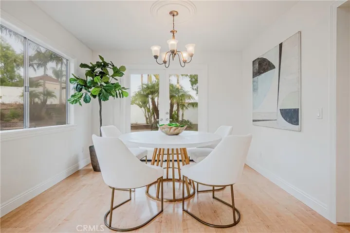 The spacious dining area completes the wonderful living spaces overlooking and opening to the gorgeous backyard setting.