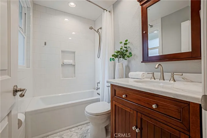 Bathroom #2 - Remodeled hallway baths with shower in tub.