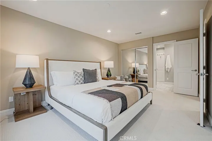 Primary Bedroom - Spacious, bright with views of the hills features a beautifully remodeled bath with a large and relaxing tub and expansive vanity with dual sinks and ample storage.
