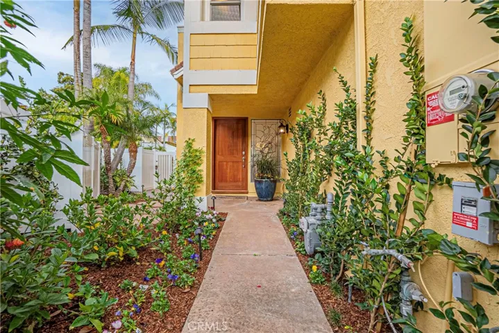 The entry courtyard greets you with beautiful landscaping.