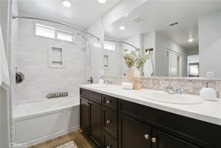 Primary Bathroom with dual sinks and jetted tub