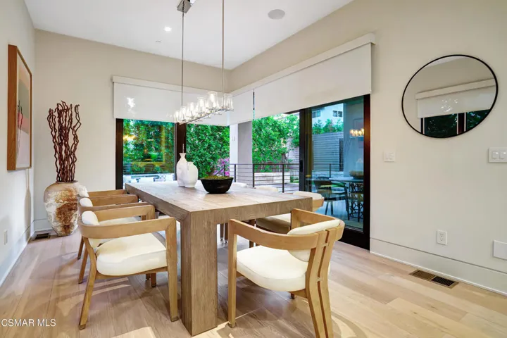 DINING ROOM WITH ACCORIDAN SLIDER DOORS
