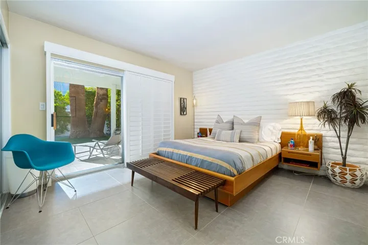 Rear bedroom leads out to the backyard.