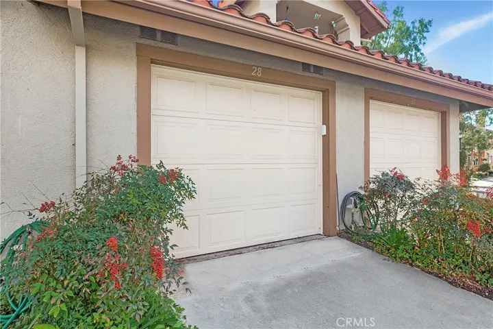 One car attached, direct access garage PLUS additional assigned parking space