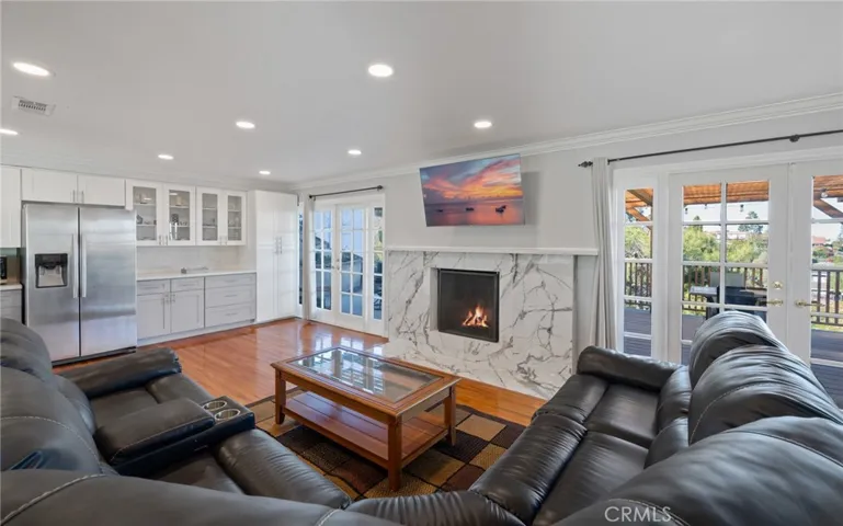Spacious living room with amazing French doors leading out to the amazing decks.