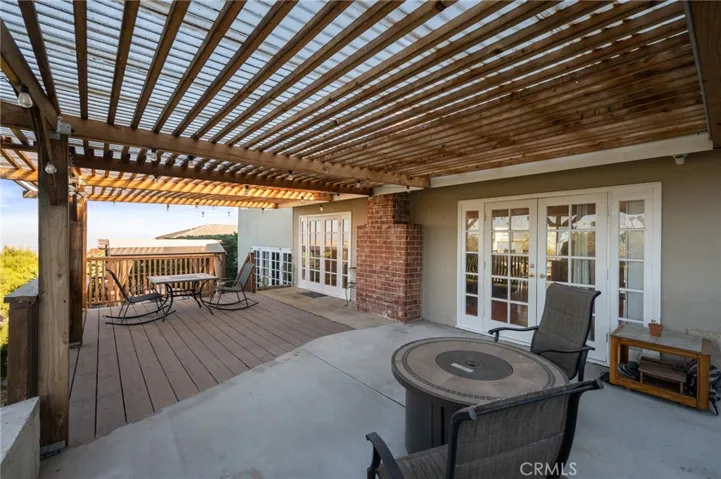 Deck one off the living room is not just an extension of the home; it's a vantage point to soak in the beauty of Los Angeles