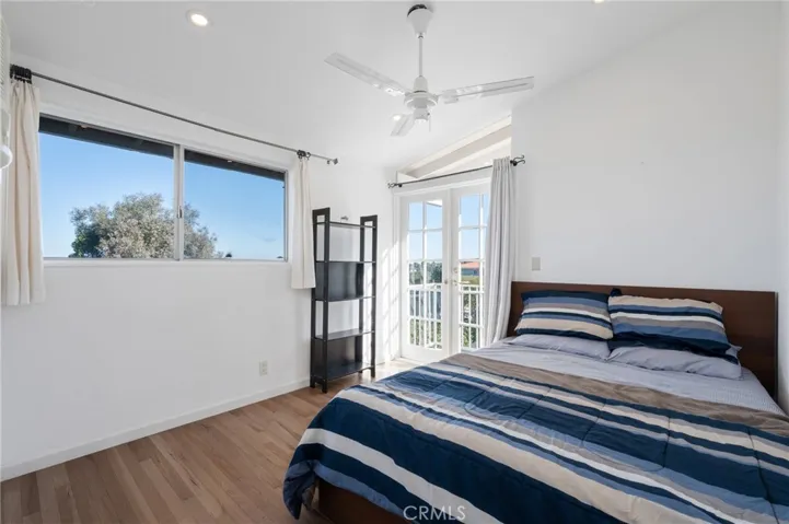 Bedroom two with a stunning view and access to balcony shared with first bedroom