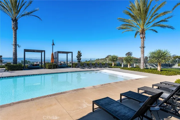 including a 3,688 sq ft pool with a sloped beach entry