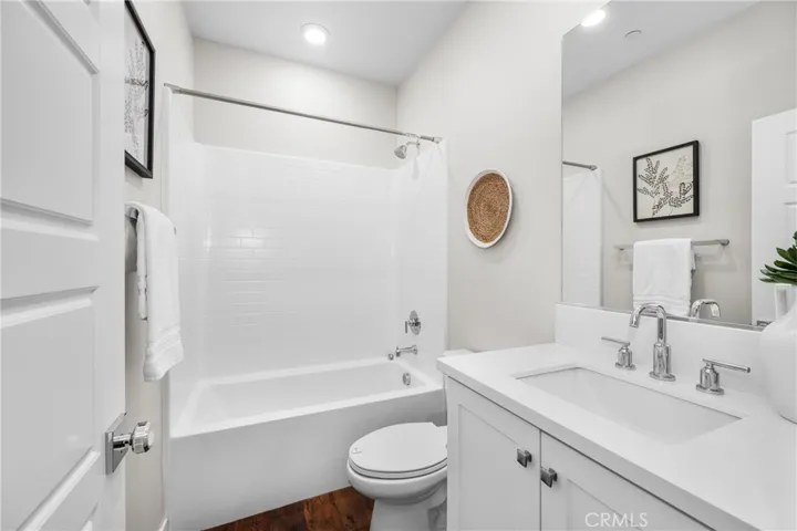 quartz countertops and a shower-in-tub