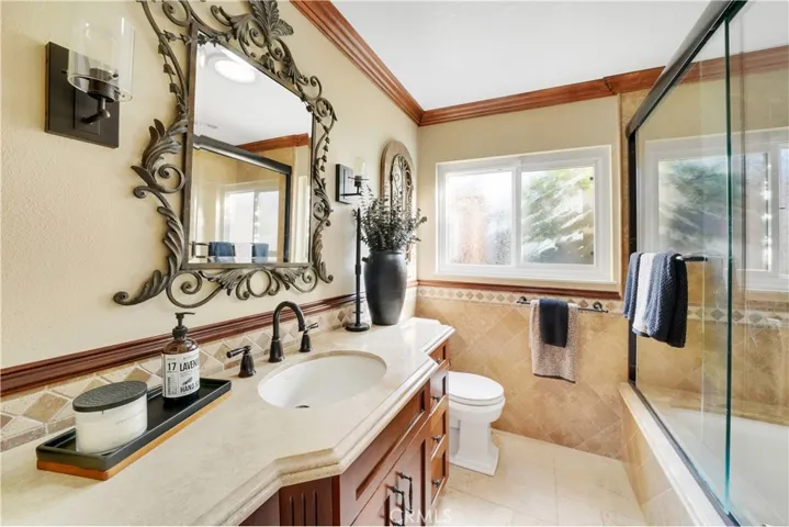 Guest bathroom, just beautiful, check out all the detail, wall sconces, crown molding, fine finishes throughout