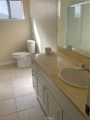Oversized hallway bathroom with two vanities
