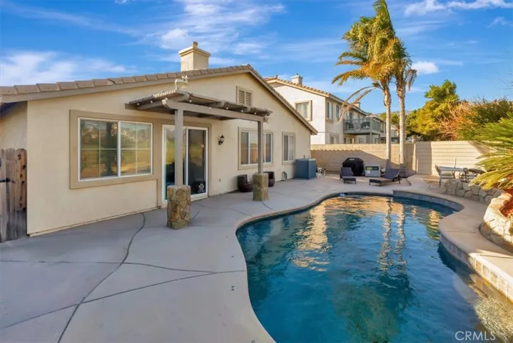 POOL!  and covered patio,  beautiful rock stonework.