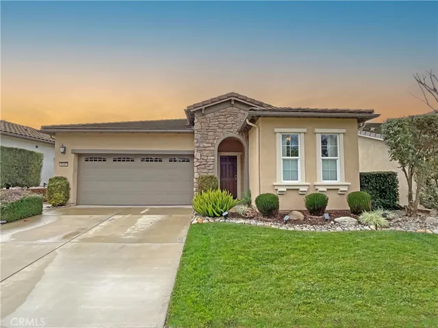 Beautiful Curb Appeal is accentuated with the river rock detail.