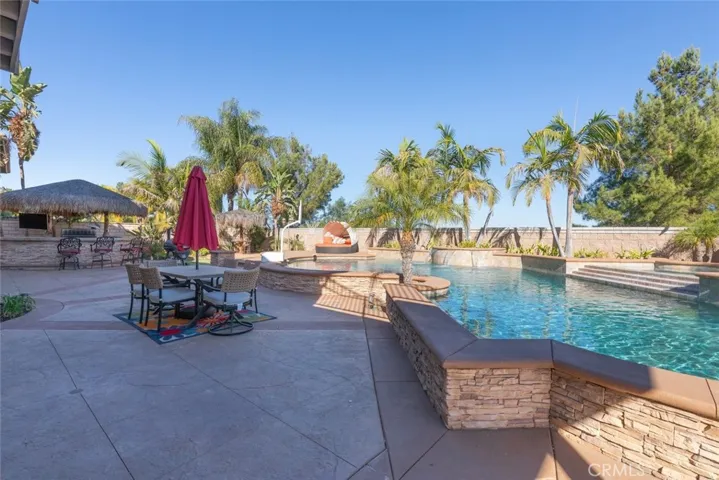 Ideal outdoor retreat and ample space for gathering and entertaining by the pool.